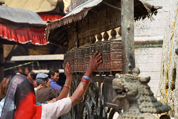 Pilgrims Spinning Prayer Wheels At Swayambhunath Stupa, Kathmandu, Nepal